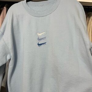 Baby blue Nike drip sweater from Etsy